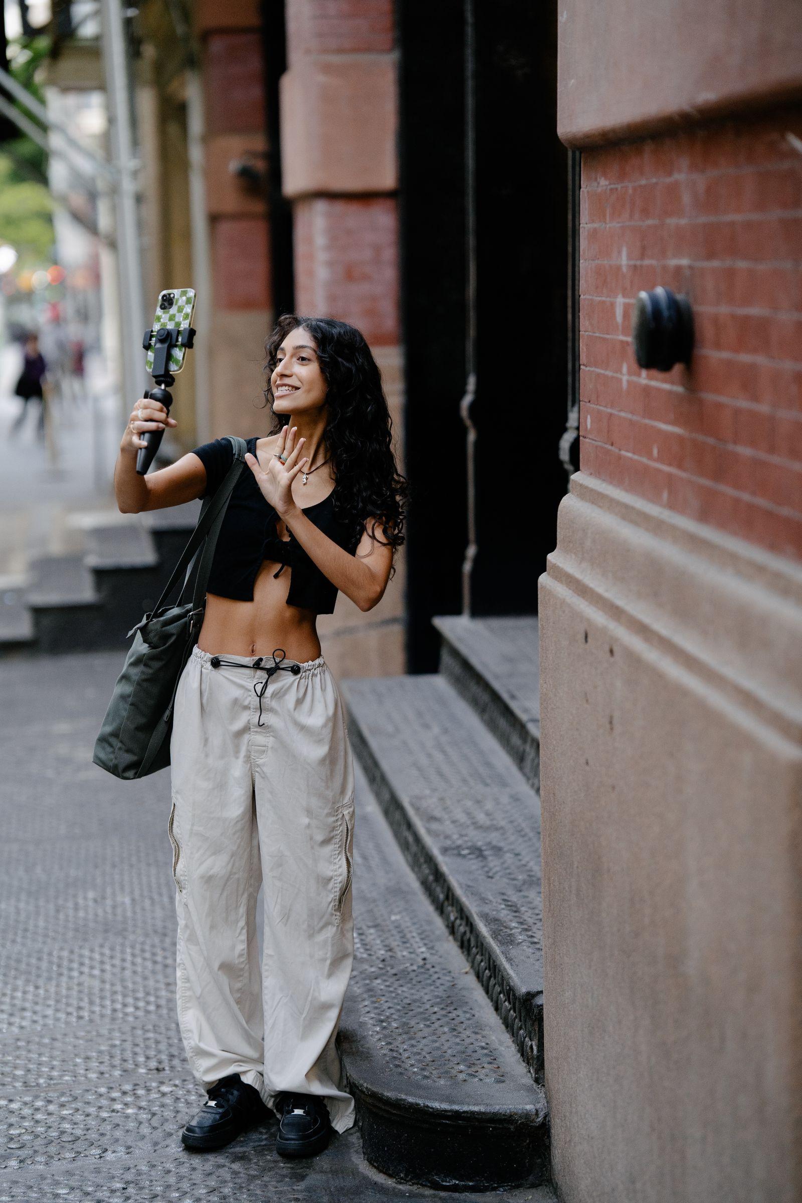 A creator filming content on the street